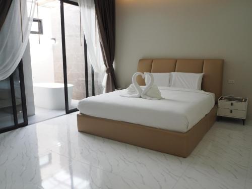 Katil atau katil-katil dalam bilik di Baan First Pool Villa