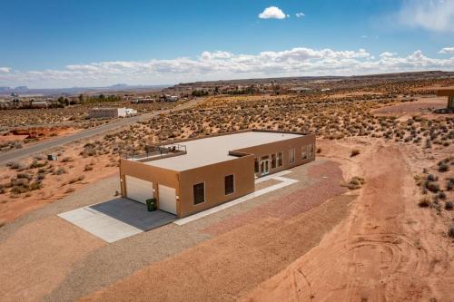 a house in the middle of the desert at Canyon Oasis suite with Grand Mesa view in Big Water