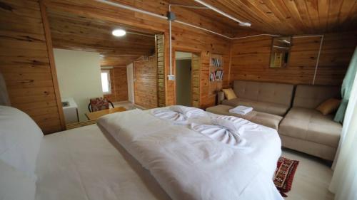 a bedroom with a large bed and a couch at Sultanahmet Center View Apart Hotel in Istanbul