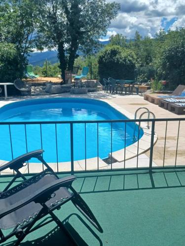 a swimming pool with a fence around it at Apartments Bosket in Kastav