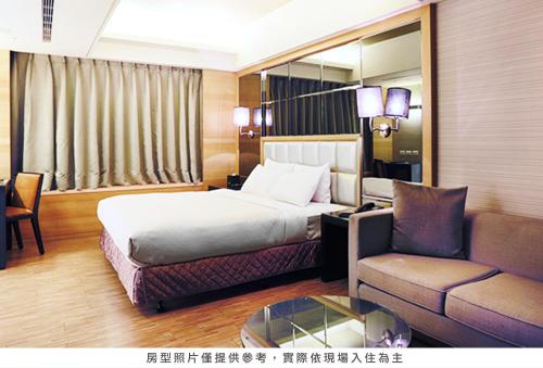 Postel nebo postele na pokoji v ubytování Royal Group Hotel Chang Chien Branch