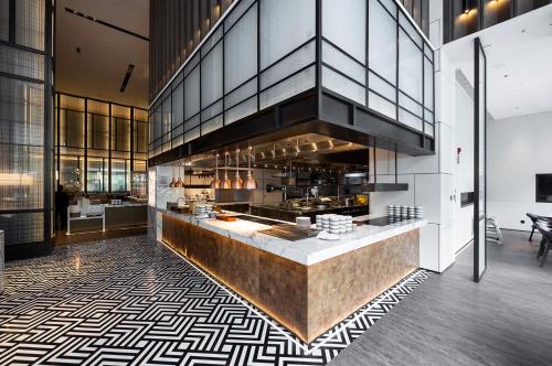 a kitchen with a counter in a building at Luoyang Marriott Hotel in Luoyang