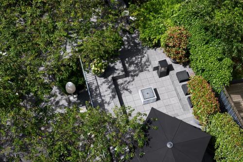 an overhead view of a patio with an umbrella at The George Hamburg in Hamburg