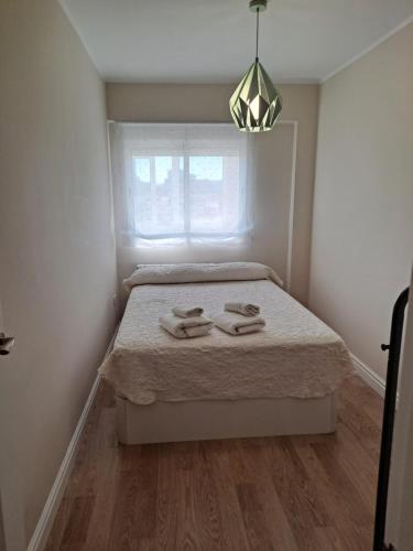 A bed or beds in a room at EchegarayPlace