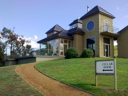 a house with a sign in front of it at Sutherland Estate - Stunning Yarra Valley Vineyard in Dixons Creek