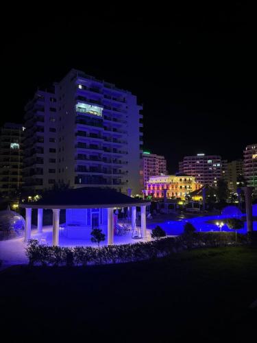 a night view of a building with blue lights at Caesar Resort & SPA - Apartment with 2 Bedroom - Aurelius in Saint Yeorgios
