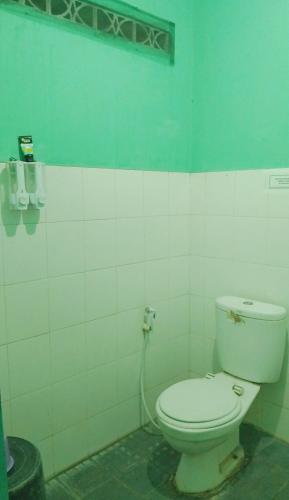 Um banheiro em Hotel Kawsar Syariah