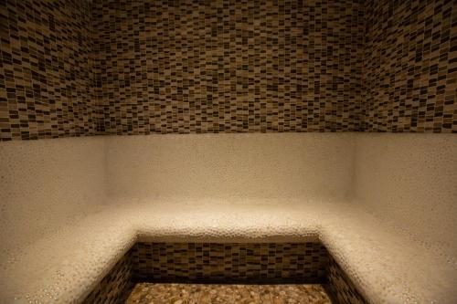 a corner of a room with a brick wall at Hotel Gino Wellness Mtskheta in Mtskheta