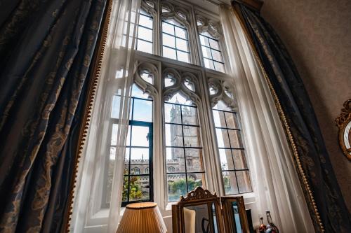 a large window in a room with a lamp at Thornbury Castle - A Relais & Chateaux Hotel in Thornbury