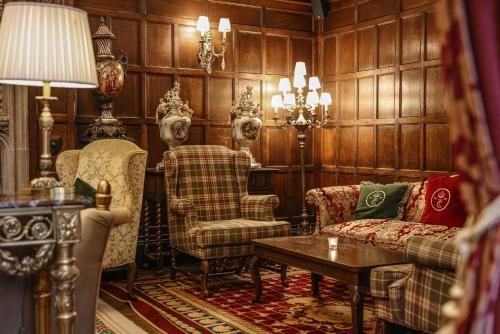 a living room with a couch and chairs and a table at Thornbury Castle - A Relais & Chateaux Hotel in Thornbury