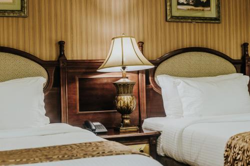 Ένα ή περισσότερα κρεβάτια σε δωμάτιο στο Villa Caceres Hotel