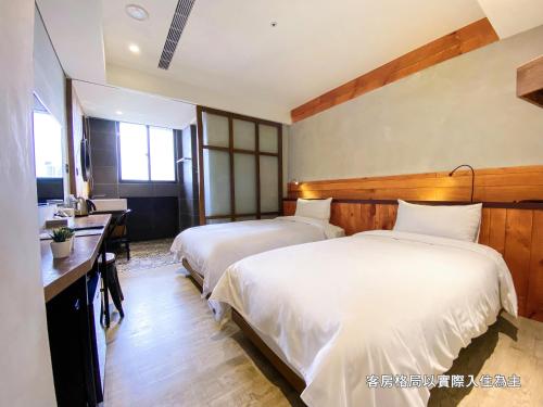 Postel nebo postele na pokoji v ubytování Central Land Hotel