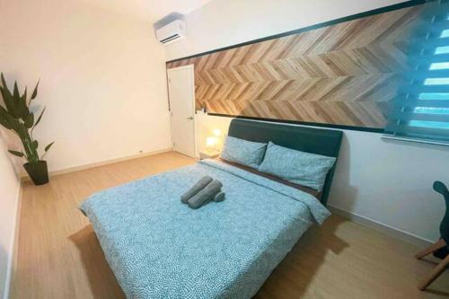 Ένα ή περισσότερα κρεβάτια σε δωμάτιο στο Continew Residence Cozy Suite by GUESTONIC