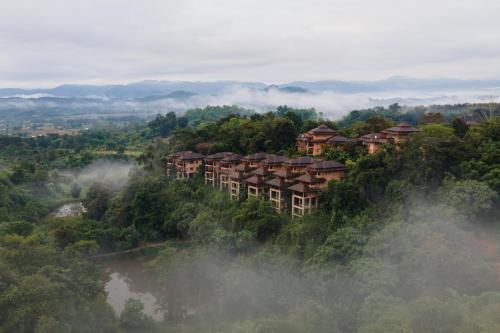 a resort on a hill in the middle of a forest at Katiliya Mountain Resort And Spa in Mae Salong Nai