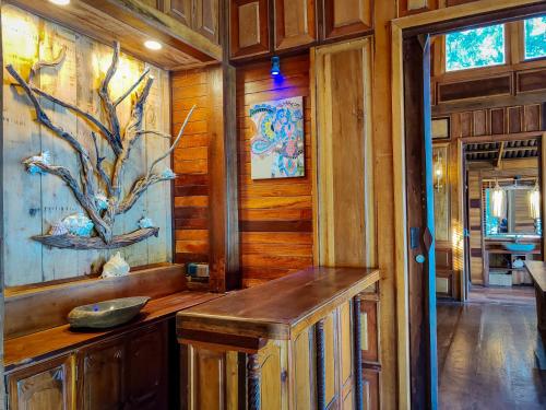 a bathroom with a sink in a wooden room at Full Moon Island Resort in Kaoh Sdach