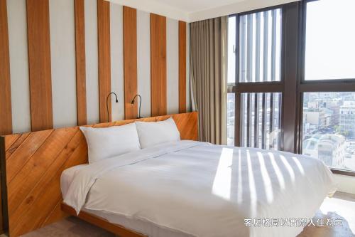 Postel nebo postele na pokoji v ubytování Central Land Hotel