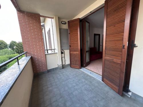 an open door of a house with a balcony at Appartamento Al Poggio in Besana in Brianza