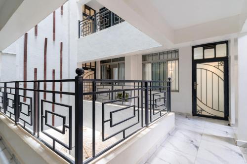 a balcony with black railings in a house at Serene Homes in Ruiru