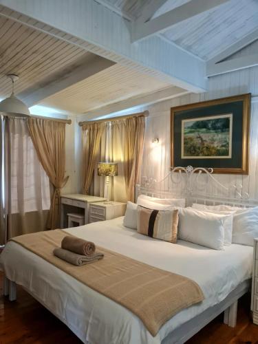 Ένα ή περισσότερα κρεβάτια σε δωμάτιο στο Point Village Accommodation - Hemel op Aarde