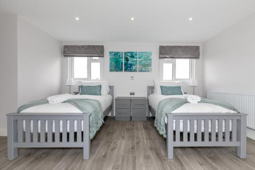 Ένα ή περισσότερα κρεβάτια σε δωμάτιο στο Maple Lodge