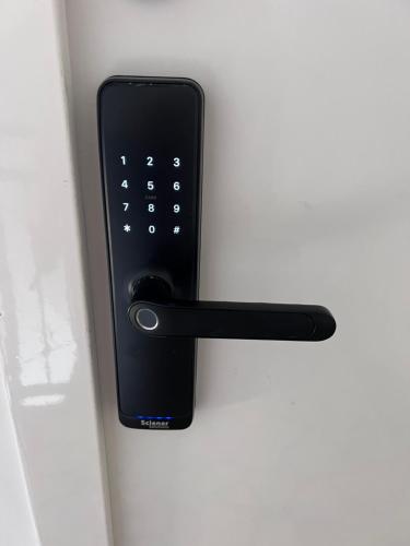a black remote control is attached to a door at Villa Ana - Charming Appartments in Belgrade