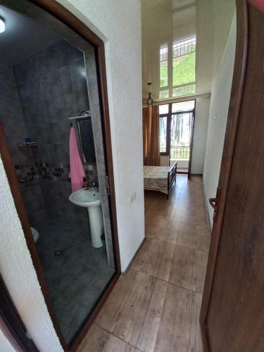 a bathroom with a shower and a sink in a room at Leto by Sveta in Ureki