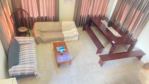 an overhead view of a living room with a couch and a table at Wide Horizons Mountain Retreat in Malkerns
