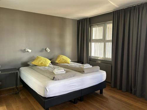 Postel nebo postele na pokoji v ubytování Ármót Guesthouse