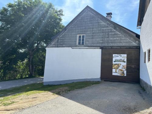 a garage with a large white garage door at Wandlhof Ferienwohnung 3971 Sankt Martin in Zeil