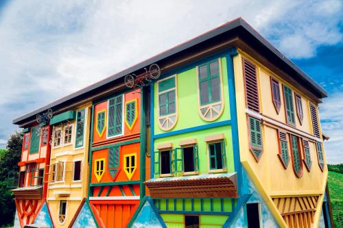 a colorful building with colorful windows on it at MEDDOM Park in Cao Phong