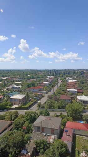 an overhead view of a town with buildings and trees at Apartment in Zugdidi