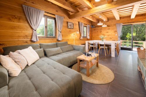 a living room with a couch and a table at Roubenka Sobotín in Sobotín