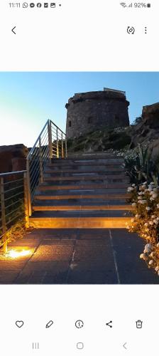 a set of stairs leading up to a castle at B&B Nuovo Capo Altano in Portoscuso