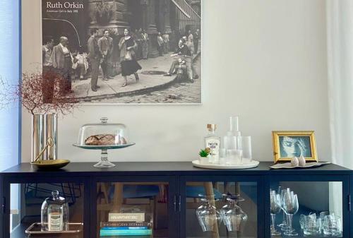 a table in a room with a picture on the wall at Beaumont Residence in Auckland