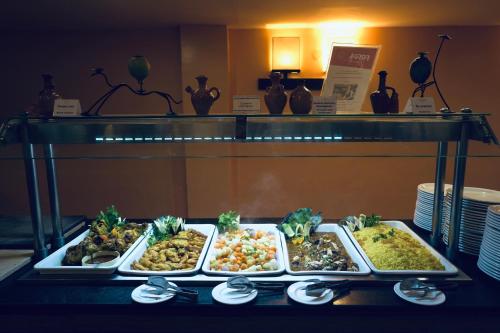 a buffet line with many different types of food at Alhambra Thalasso in Hammamet