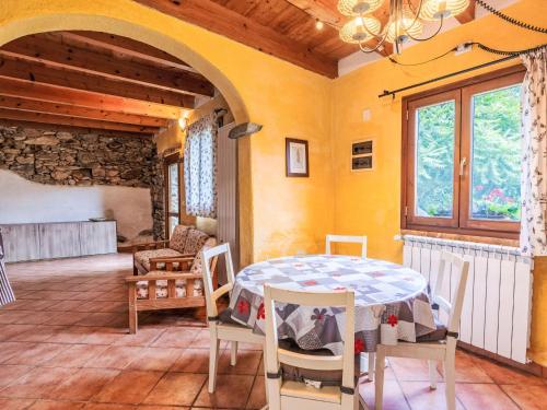 a dining room with a table and chairs at Holiday Home La casa del Fiume by Interhome in Rialto