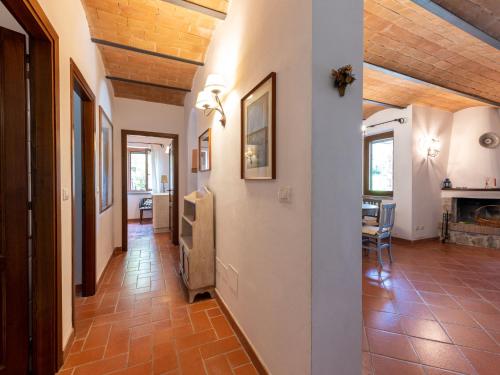 a hallway with a living room and a dining room at Villa La Gattaiola Piccola by Interhome in Montemerano