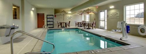 a large swimming pool in a hotel room at Cobblestone Hotel & Suites - Broken Bow in Broken Bow