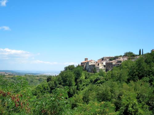 a building on top of a hill with trees at Holiday Home La terrazza sulla Maremma by Interhome in Scansano