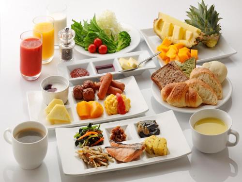 a table with three plates of food and drinks at Hotel Union in Kagoshima