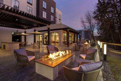 an outdoor patio with chairs and a fire pit at Homewood Suites By Hilton Missoula in Missoula