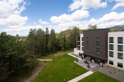 an aerial view of a building with a yard at Homewood Suites By Hilton Missoula in Missoula