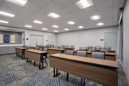 a classroom with desks and chairs in a room at Homewood Suites By Hilton Missoula in Missoula