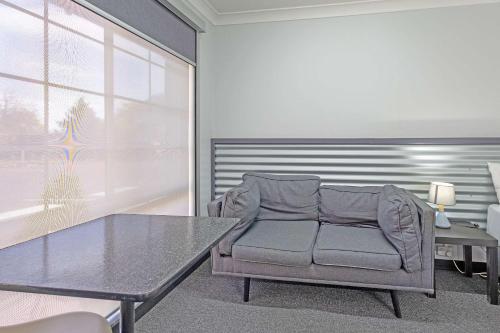Zona de estar de Shearing Shed Motor Inn
