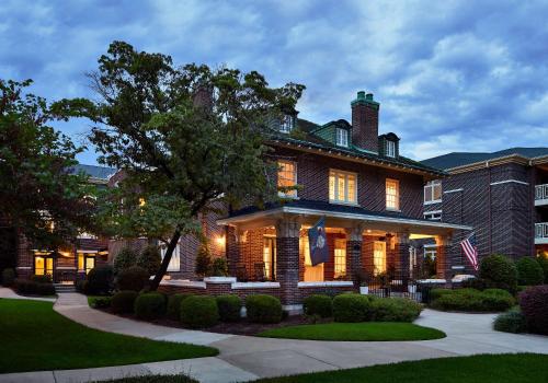 a large brick house with an american flag at Graduate by Hilton Columbia SC in Columbia
