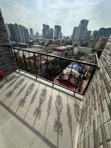a balcony of a building with a view of a city at Apartment GURO in Batumi