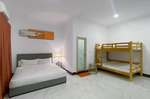 Postel nebo postele na pokoji v ubytování Easy Backpackers Paradise
