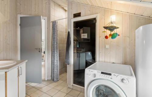 a washing machine in a bathroom with a sink at 3 Bedroom Lovely Home In Otterup in Otterup