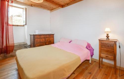 a bedroom with a bed and a dresser and a window at Nice Apartment In Sant Andrea Di Bozio in Sant Andrea di Bozio