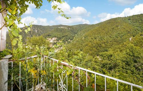 a view of a mountain with trees and a bridge at Nice Apartment In Sant Andrea Di Bozio in Sant Andrea di Bozio